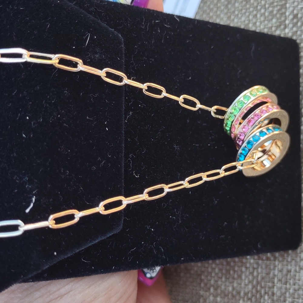 Park Lane gold plated necklace with 3 rhinestone rings.